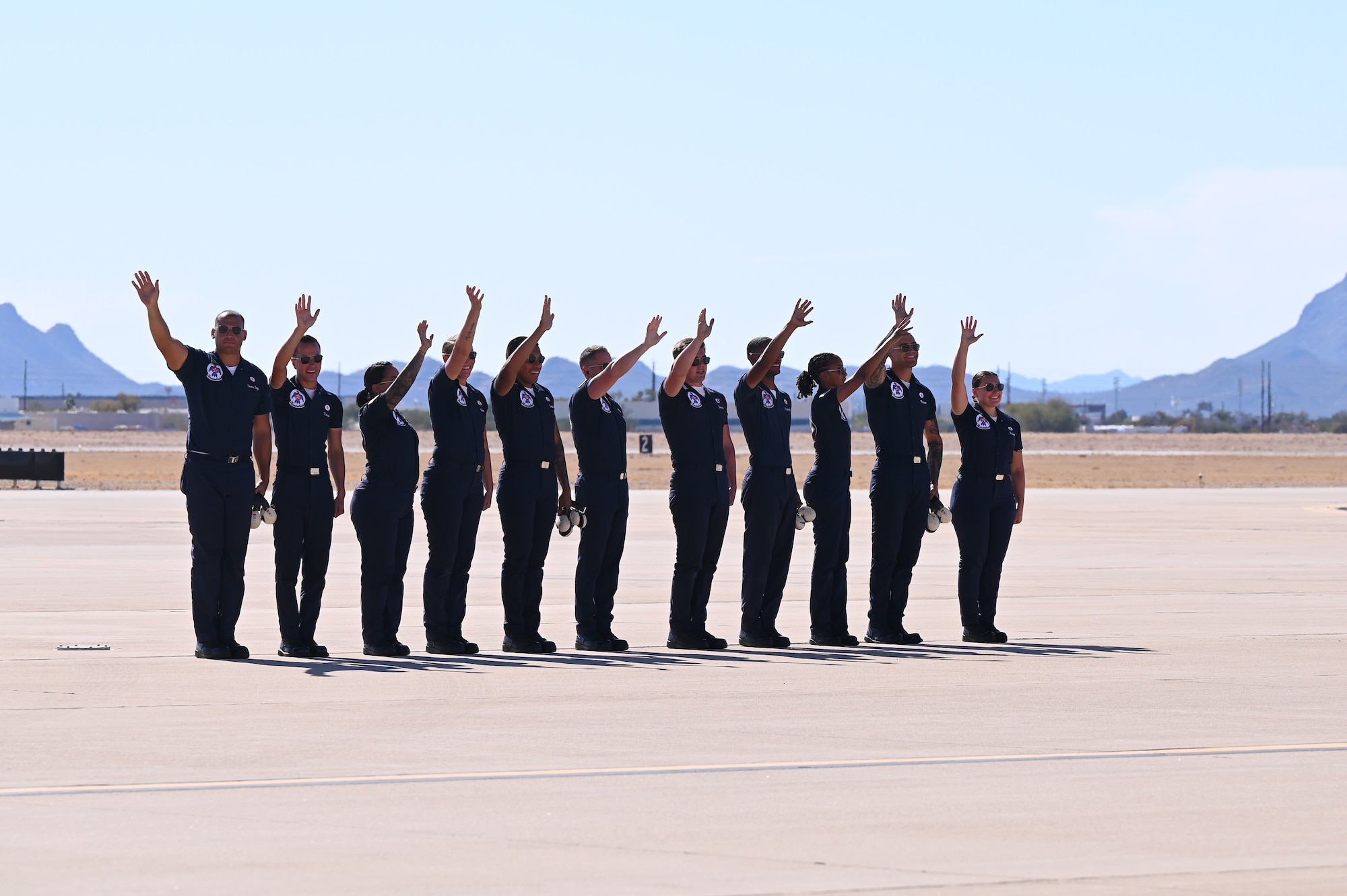The United States Air Force Air Demonstration Squadron "Thunderbirds” waves at the crowd during the Thunder and Lightning Over Arizona Air Show at Davis-Monthan Air Force Base, Arizona, March 23, 2025. DM’s air show was a biannual event which gave people a chance to see U.S. Air Force airpower, like the Thunderbirds, in action. (U.S. Air Force photo by Senior Airman Andrew Garavito)