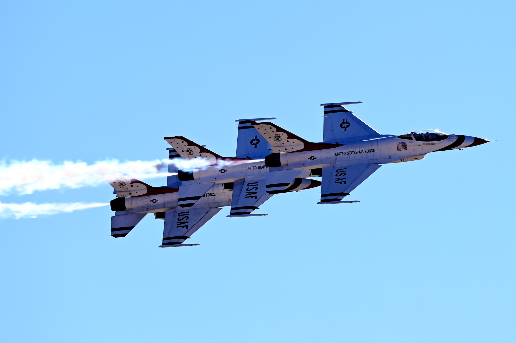 The United States Air Force Air Demonstration Squadron "Thunderbirds” fly overhead during the Thunder and Lightning Over Arizona Air Show at Davis-Monthan Air Force Base, Arizona, March 23, 2025.  The biannual air show offered guests the opportunity to tour more than 40 static displays; explore science, technology, engineering, art and math activities; and watch 15 aerial performances. (U.S. Air Force photo by Senior Airman Andrew Garavito)