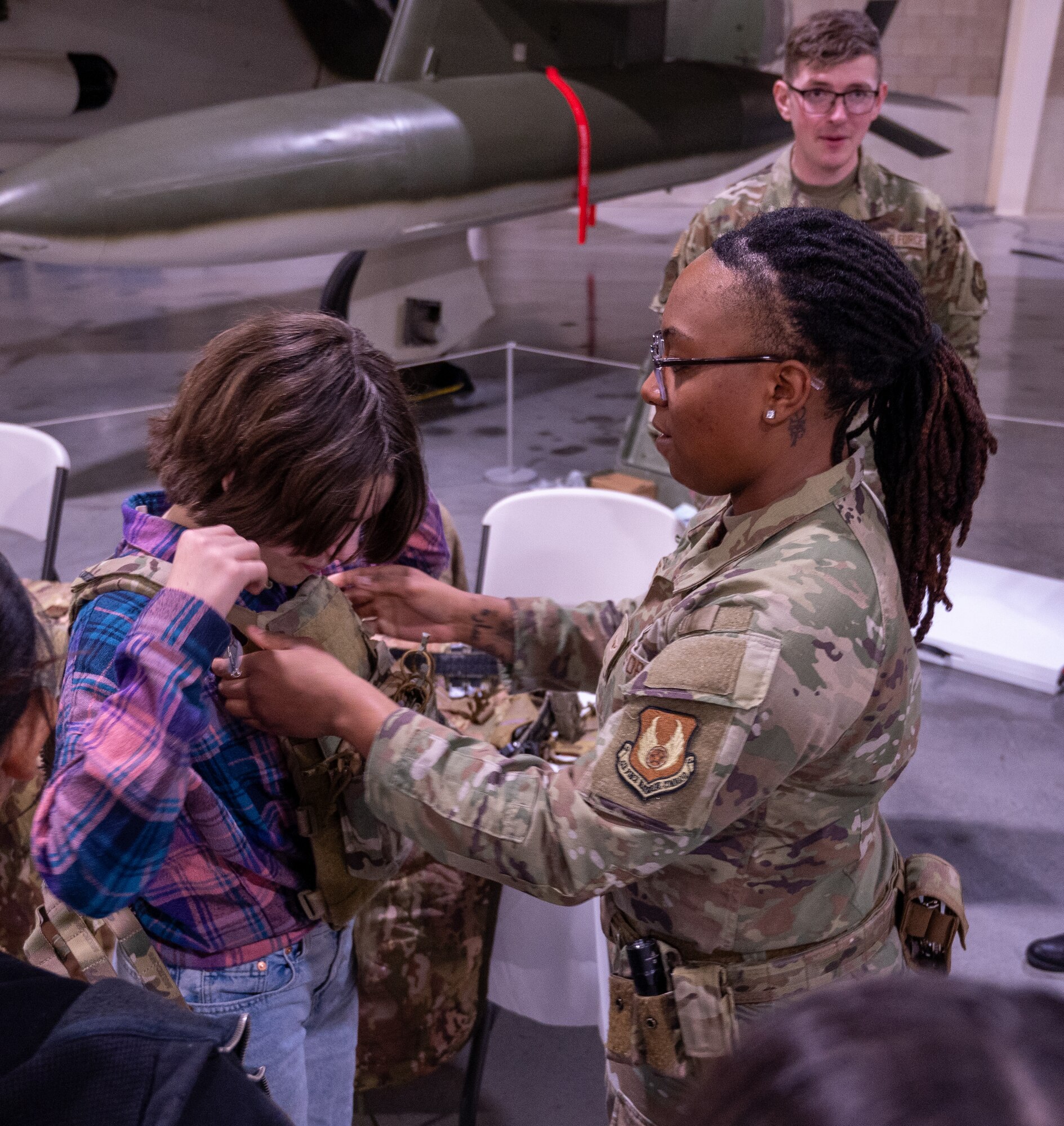 A photo of students interacting with Airmen
