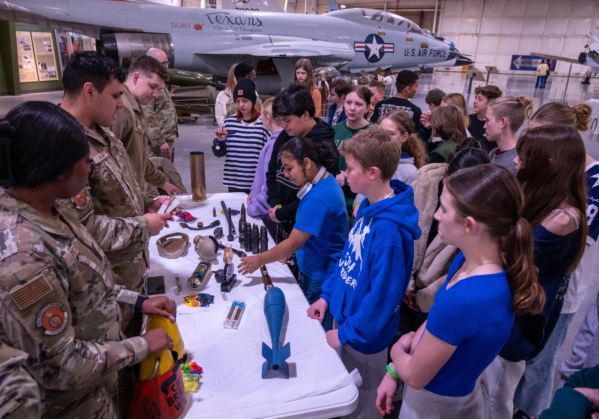 A photo of students interacting with Airmen