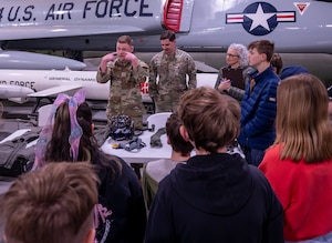 A photo of students interacting with Airmen