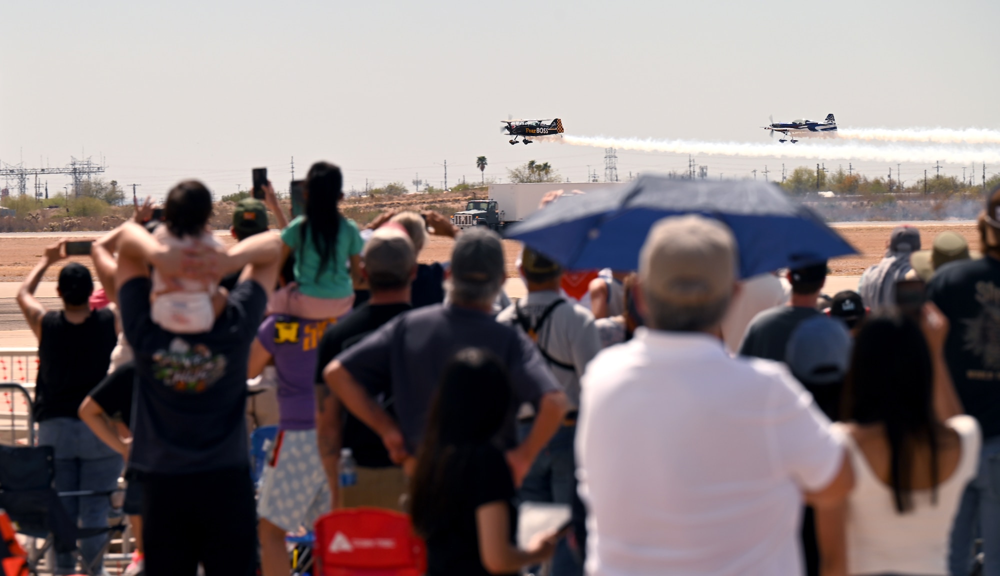 Two aircraft fly overhead during the Thunder and Lightning Over Arizona Air Show at Davis-Monthan Air Force Base, Arizona, March 23, 2025. DM’s air show was a biannual event which gave people a chance to see U.S. Air Force airpower in action. (U.S. Air Force photo by Airman Jaden Kidd)