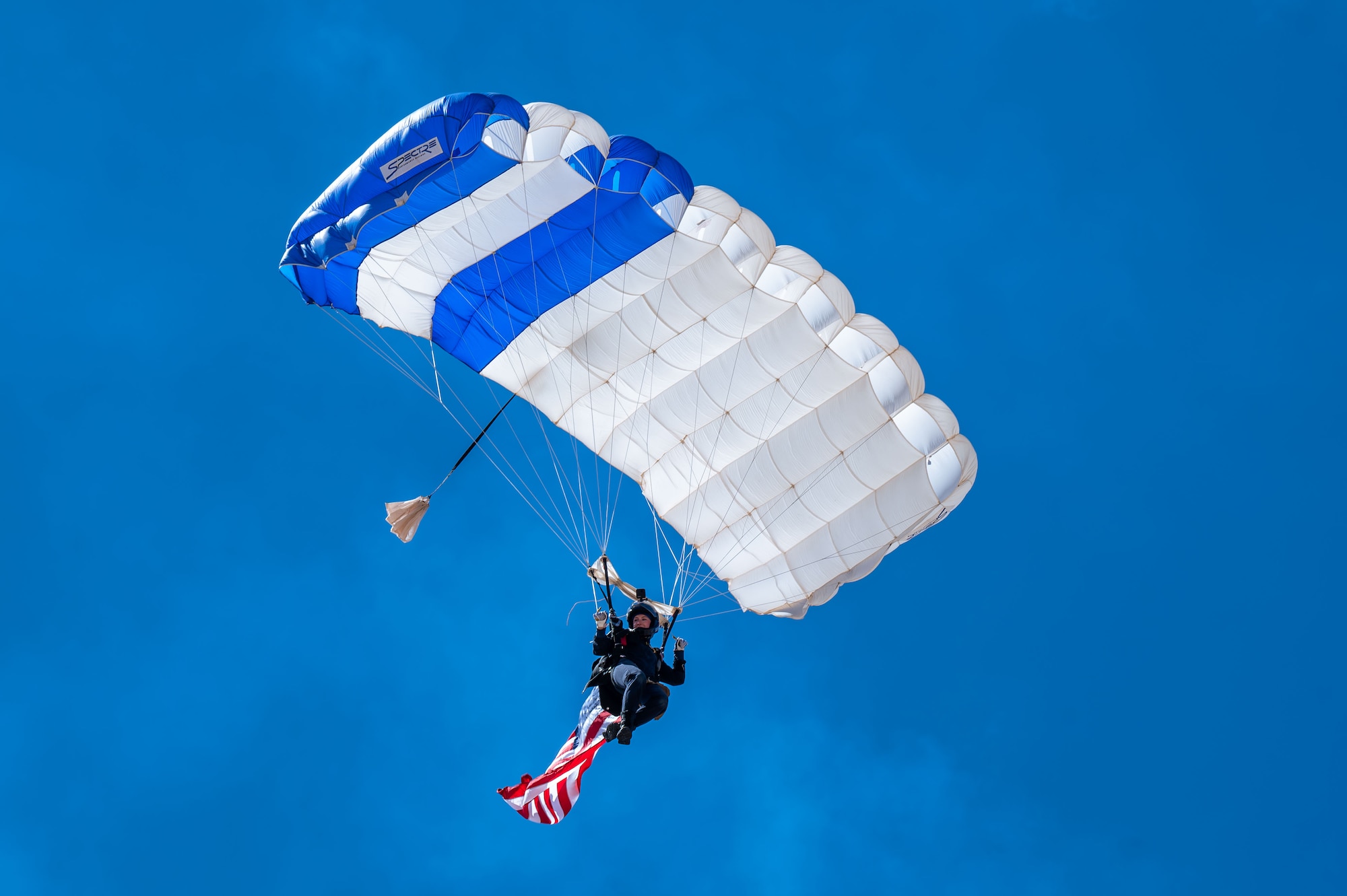 A U.S. Air Force Academy cadet, Wings of Blue Parachute Team member, parachutes during the Thunder and Lightning Over Arizona Air Show rehearsal at Davis-Monthan Air Force Base, Arizona, March 21, 2025. Each year, the team performs in front of millions of spectators at national and international parachuting demonstrations. (U.S. Air Force photo by Senior Airman Jasmyne Bridgers-Matos)