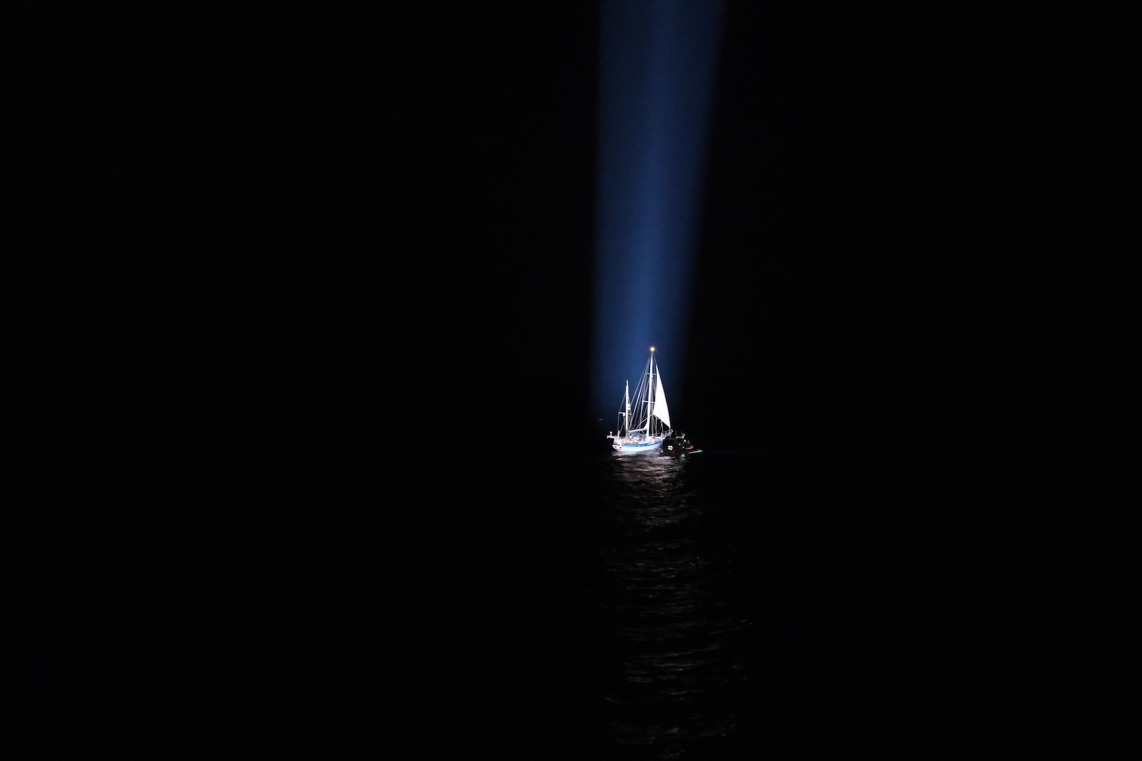 The crew of Coast Guard Cutter Mohawk (WMEC 913) identifies a sailing vessel suspected of illicit activity while underway in the Eastern Pacific Ocean, Feb. 19, 2025. During a law enforcement boarding, the crew discovered approximately 637 pounds of cocaine hidden onboard. (U.S. Coast Guard photo, courtesy Cutter Mohawk)