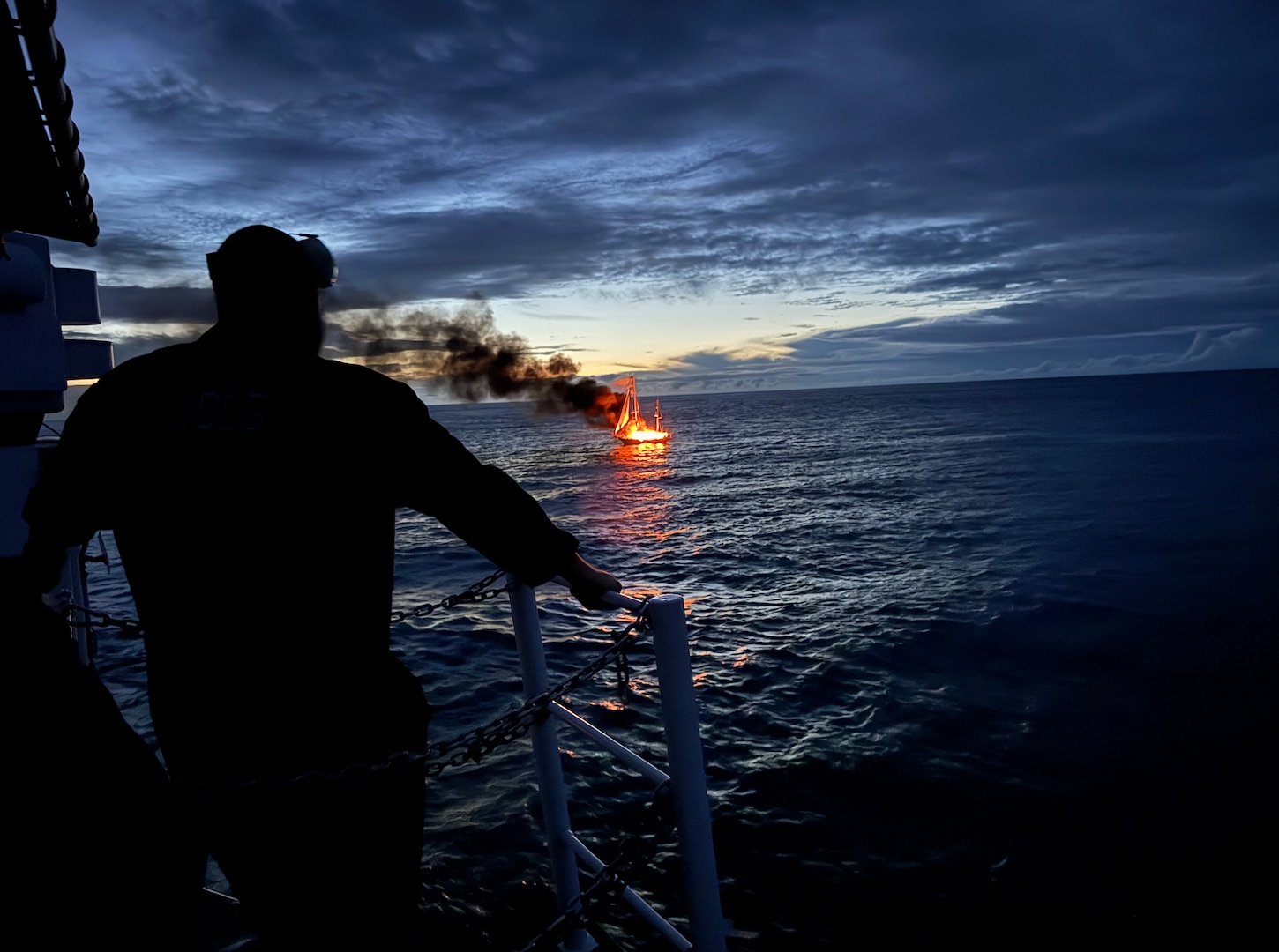 The crew of Coast Guard Cutter Mohawk (WMEC 913) identifies a sailing vessel suspected of illicit activity while underway in the Eastern Pacific Ocean, Feb. 19, 2025. During a law enforcement boarding, the crew discovered approximately 637 pounds of cocaine hidden onboard. (U.S. Coast Guard photo, courtesy Cutter Mohawk)