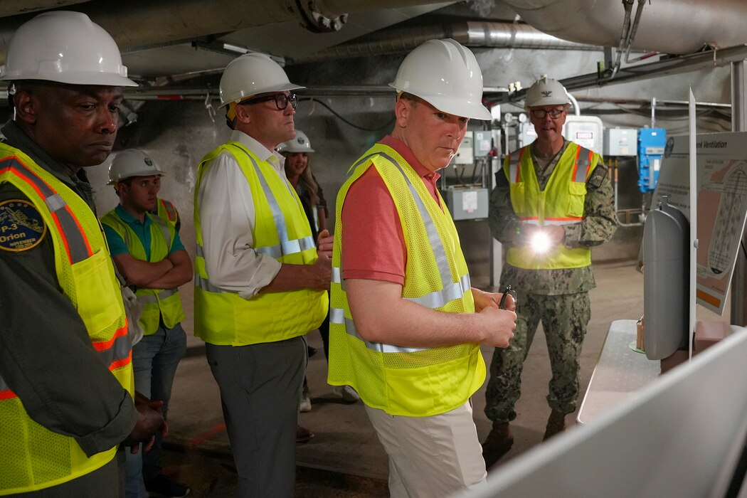 Rear Adm. Stephen Barnett, commander, Navy Closure Task Force-Red Hill (NCTF-RH) views a fuel tank size comparison model with Lee Zeldin, 17th administrator, U.S. Environmental Protection Agency, and Josh Cook, Region 9 administrator, U.S. Environmental Protection Agency, during a site visit to the Red Hill Bulk Fuel Storage Facility (RHBFSF) in Honolulu, March 22, 2025. Charged with the safe decommissioning of the facility, NCTF-RH was established by the Department of the Navy as a commitment to the community and the environment, and continues to engage with the people of Hawaii, regulatory agencies, and other stakeholders as it safely and deliberately decommissions the RHBFSF. (U.S. Navy photo by Mass Communication Specialist Seaman Krystal Diaz)