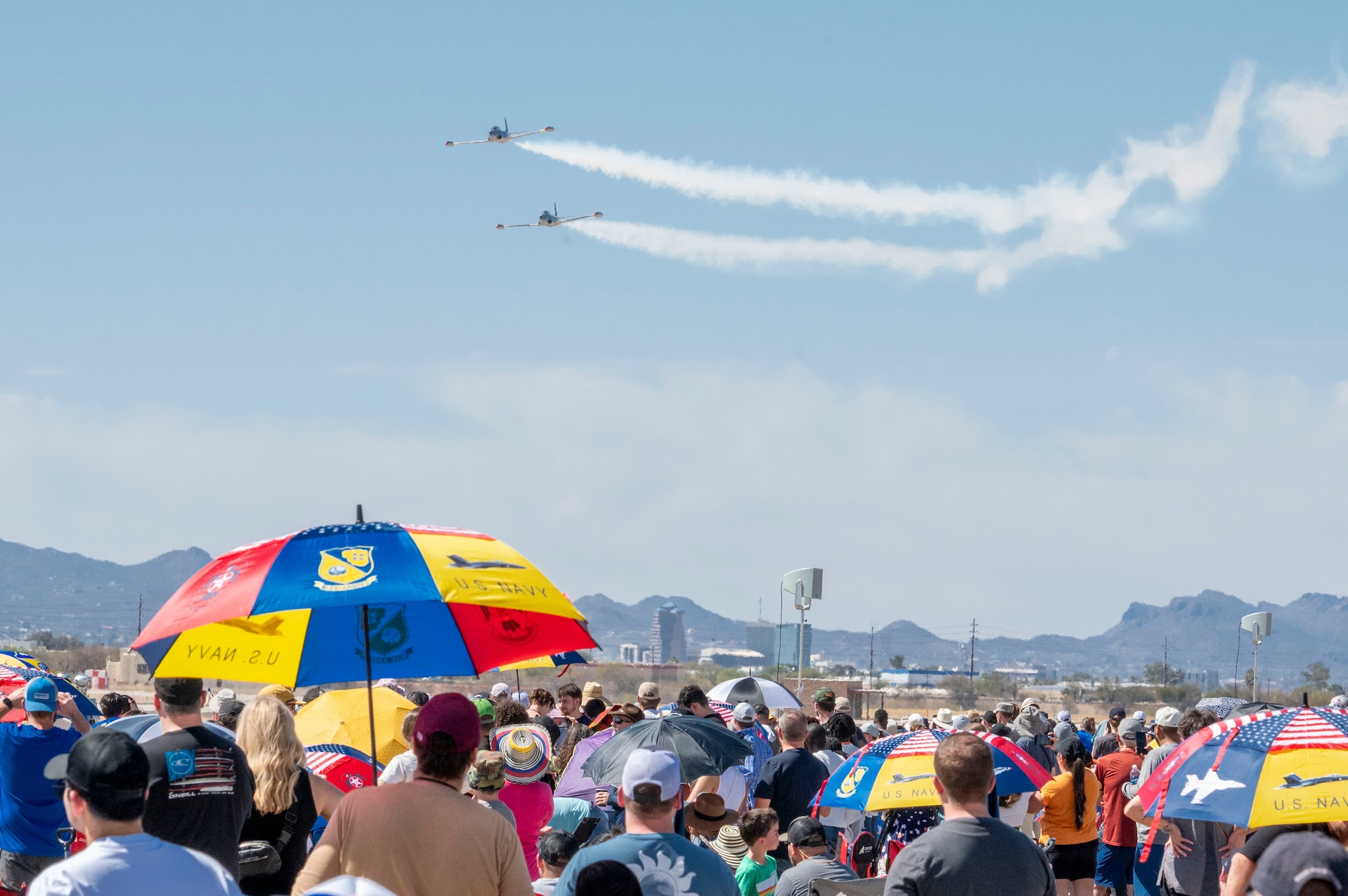 Two T33 Shooting Star aircraft perform during the 2025 Thunder and Lightning Over Arizona Air Show at Davis-Monthan Air Force Base, Arizona, March 23, 2025. The air show was open to the public as a way to connect the base and local community while also highlighting the mission and capabilities of the U.S. Air Force. (U.S. Air Force photo by Airman Samantha Melecio)