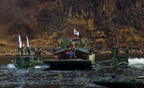 The Republic of Korea Army 5th Engineer Brigade, K600 Rhino armored vehicle crosses a river on a KM3 amphibious bridging vehicle during joint wet gap training as part of Freedom Shield 25 at Yeoncheon-gun, Republic of Korea, on March 20, 2025.