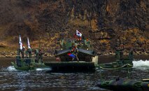 The Republic of Korea Army 5th Engineer Brigade, K600 Rhino armored vehicle crosses a river on a KM3 amphibious bridging vehicle during joint wet gap training as part of Freedom Shield 25 at Yeoncheon-gun, Republic of Korea, on March 20, 2025.