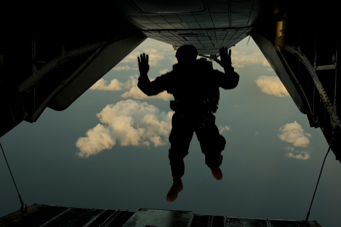 A U.S. Marine with Force Reconnaissance Platoon, Maritime Raid Force, 31st Marine Expeditionary Unit, jumps from a U.S. Marine Corps MV-22B Osprey assigned to Marine Medium Tiltrotor Squadron 262 (Rein.), during parachute operations for a Reconnaissance and Surveillance exercise at Ie Shima Training Facility, Okinawa, Japan, Mar. 20, 2025.