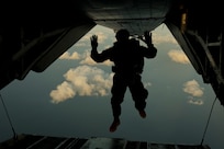 A U.S. Marine with Force Reconnaissance Platoon, Maritime Raid Force, 31st Marine Expeditionary Unit, jumps from a U.S. Marine Corps MV-22B Osprey assigned to Marine Medium Tiltrotor Squadron 262 (Rein.), during parachute operations for a Reconnaissance and Surveillance exercise at Ie Shima Training Facility, Okinawa, Japan, Mar. 20, 2025.