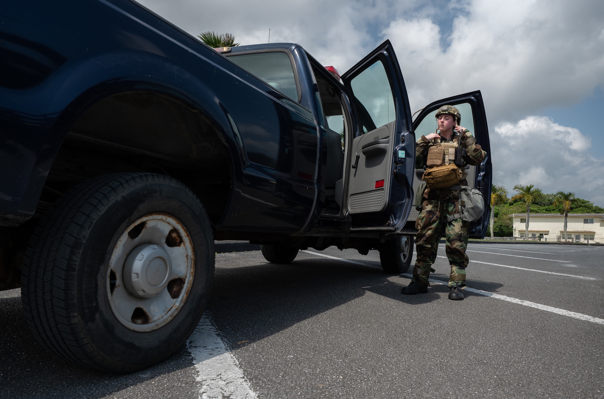 A U.S. service member dons chem gear.