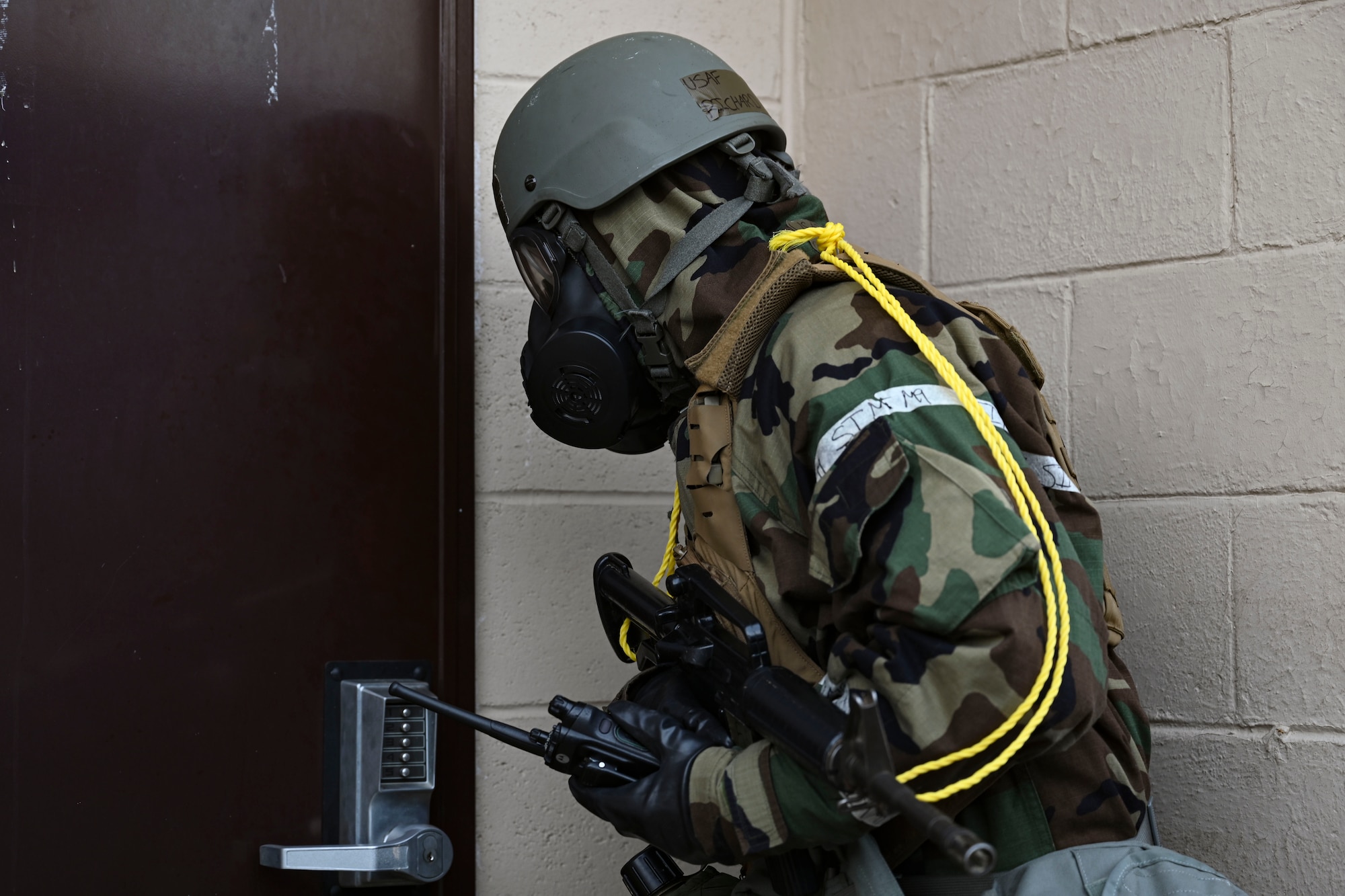 U.S. Air Force Staff Sgt. Richard Lloyd, 8th Communications Squadron expeditionary communications NCO in charge, facility entry sign procedures after conducting a post-attack reconnaissance sweep during Freedom Shield 25 at Gwangju Air Base, Republic of Korea.