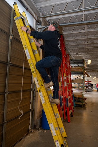 Image of person climbing a ladder.