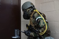 U.S. Air Force Staff Sgt. Richard Lloyd, 8th Communications Squadron expeditionary communications NCO in charge, facility entry sign procedures after conducting a post-attack reconnaissance sweep during Freedom Shield 25 at Gwangju Air Base, Republic of Korea.