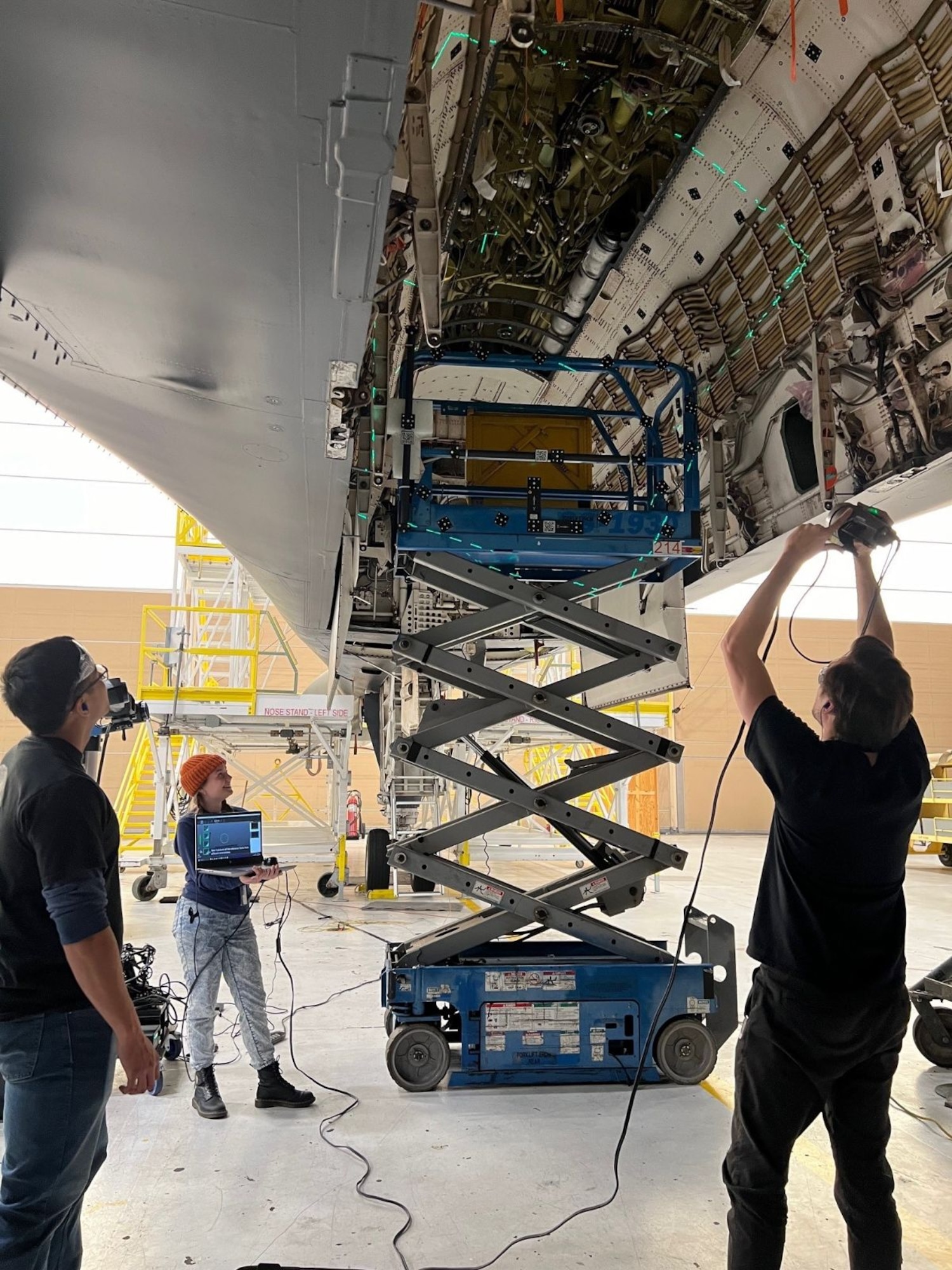 Three engineers scanning a B1 aircraft