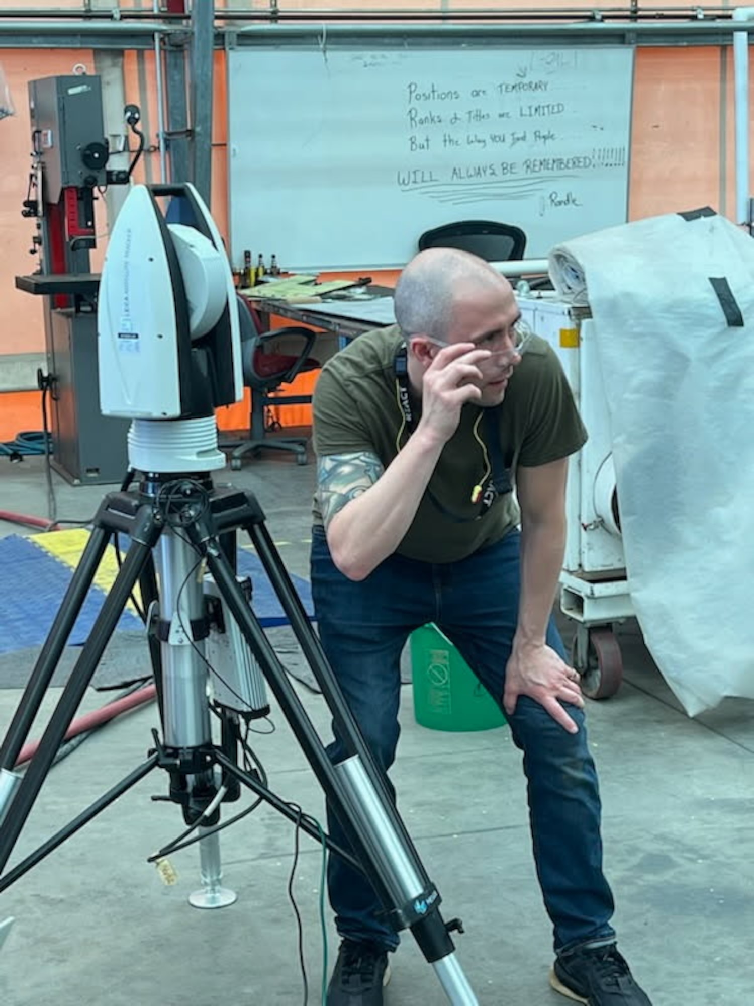 A man tilting his safety glasses