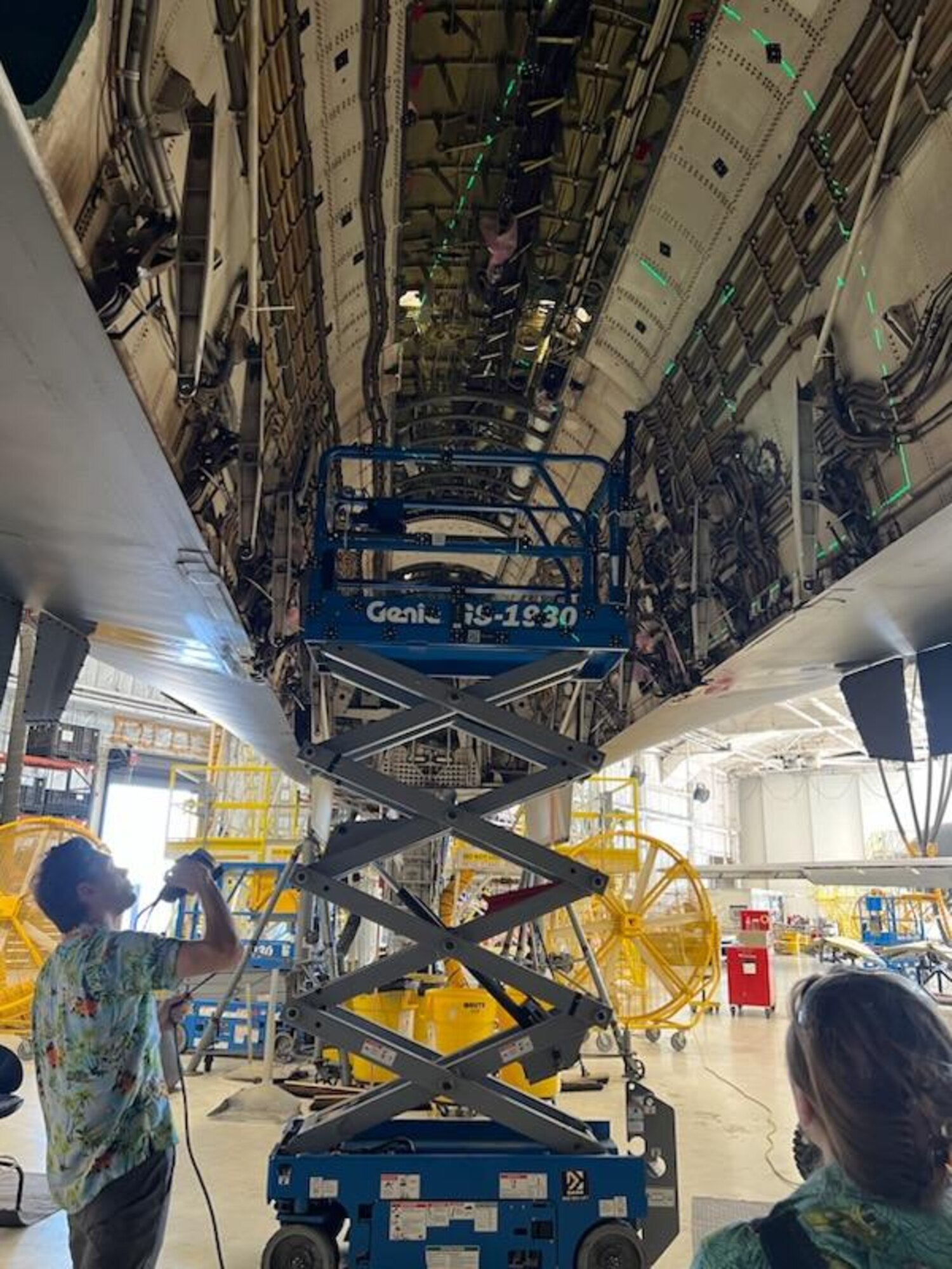 Two engineers working on a B1 aircraft.