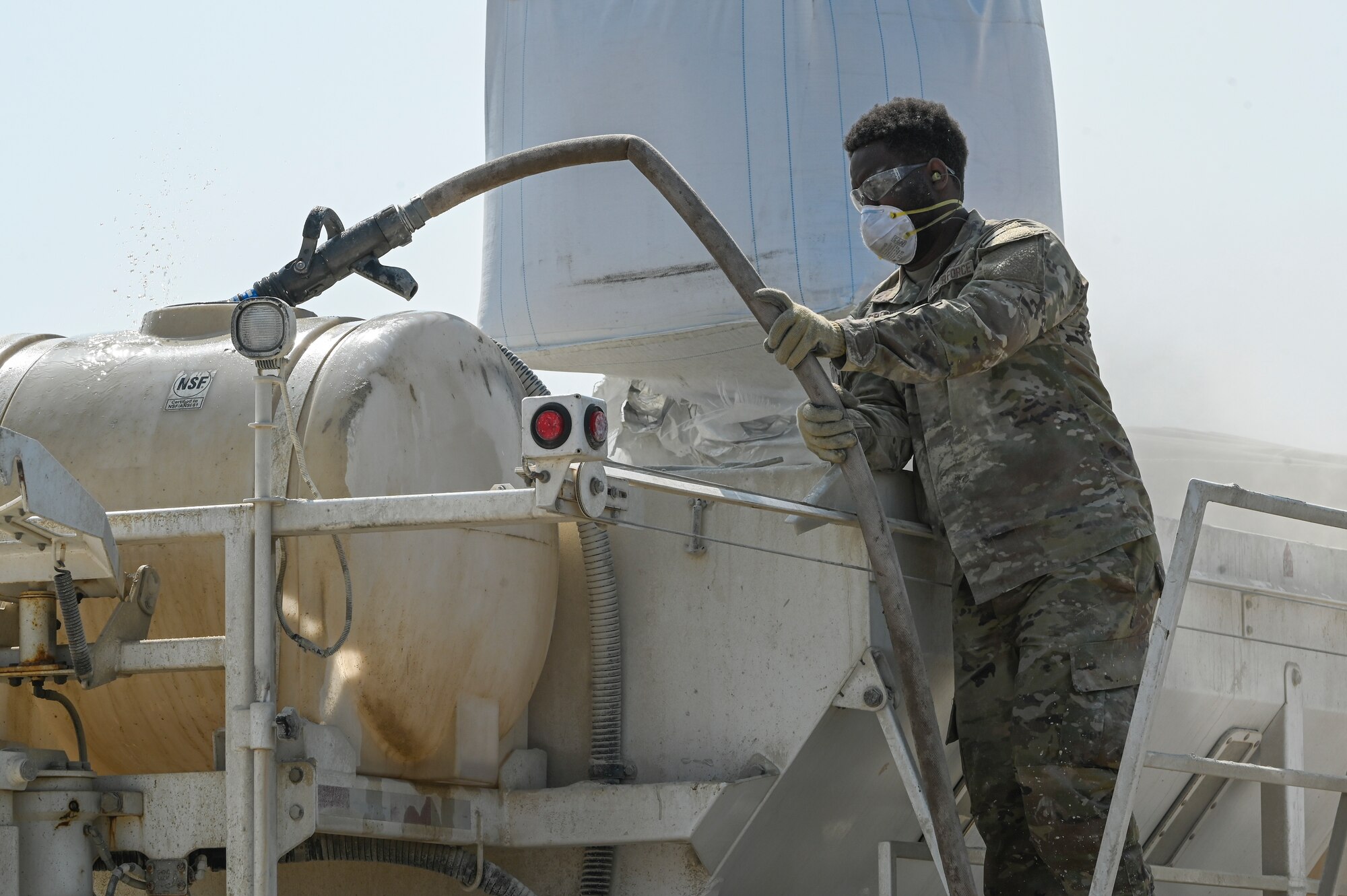 Senior Airman Kyrin Brown, 8th Civil Engineer Squadron water fuels systems maintenance journeyman, fills a tank with water during a Rapid Airfield Damage Recovery after a simulated attack during Freedom Shield 25 at Kunsan Air Base, Republic of Korea.