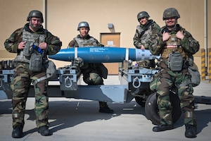 Airmen assigned to the 8th Maintenance Squadron Munitions Flight pose for a photo during Freedom Shield 25 at Kunsan Air Base, Republic of Korea.