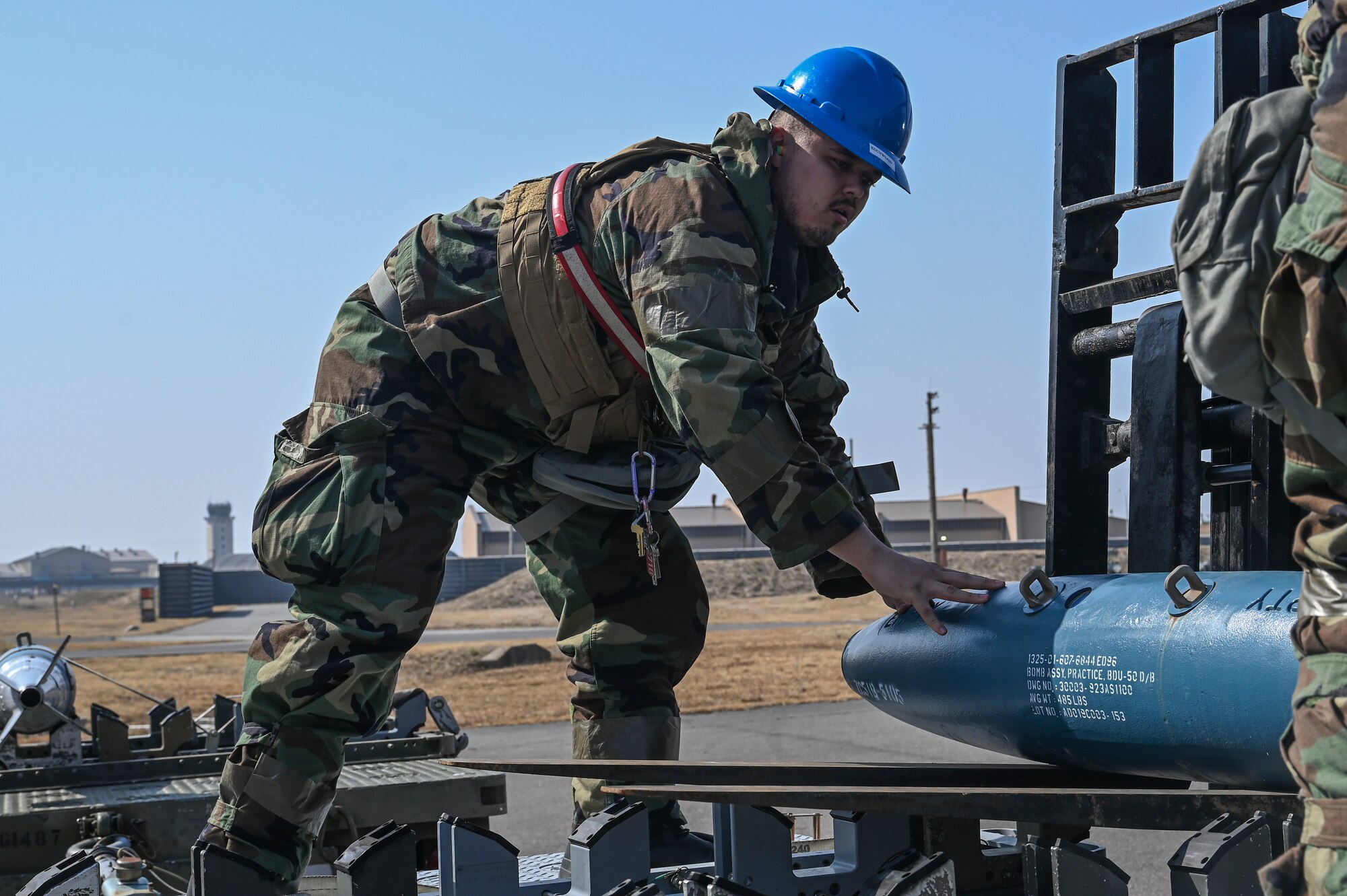 Senior Airman Jonathan Bowe, 8th Maintenance Squadron munitions inspector, transports a training munition during Freedom Shield 25 at Kunsan Air Base, Republic of Korea.