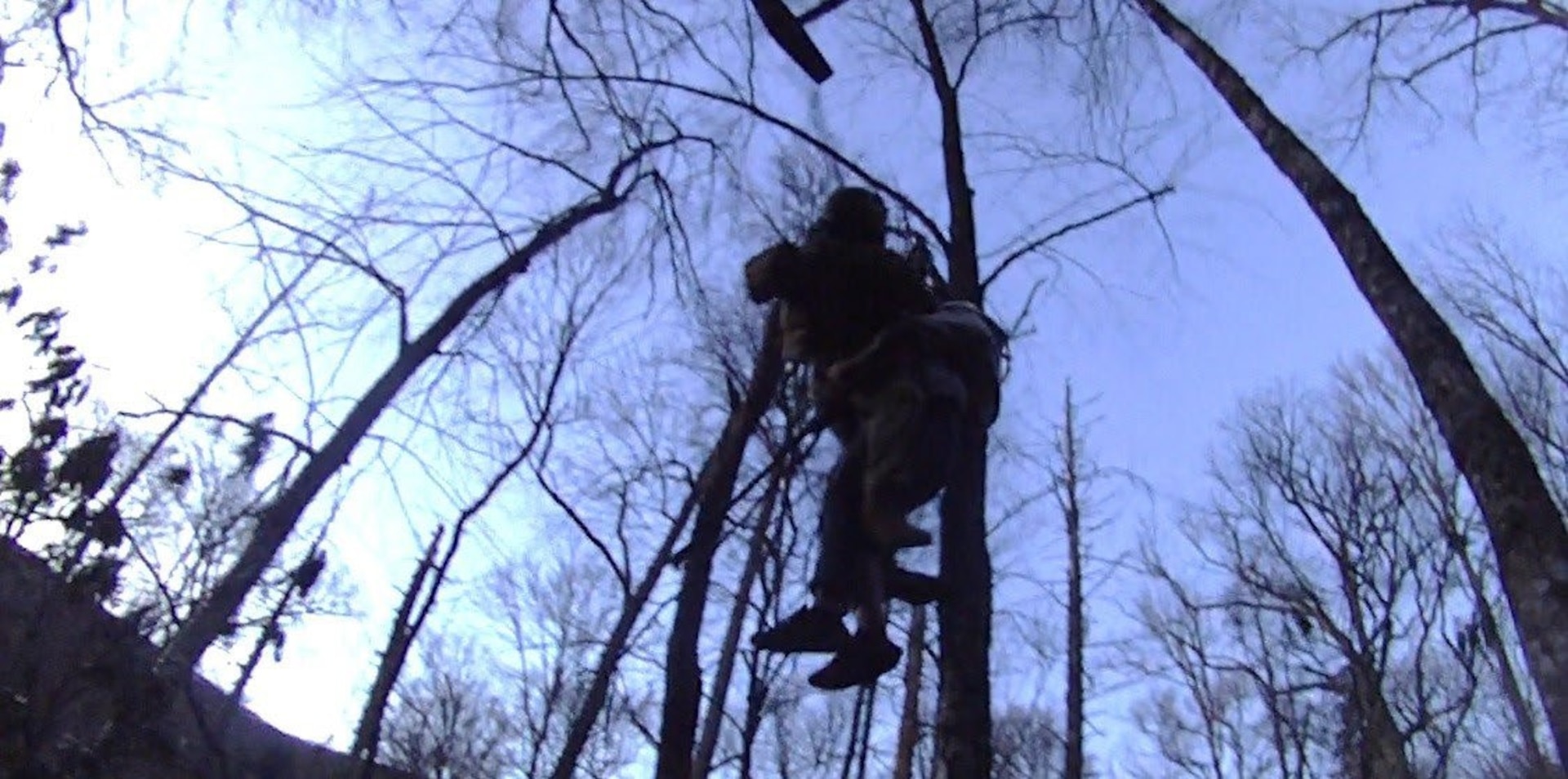 Sgt. 1st Class John Sharbel, with the Tennessee Army National Guard, and an injured hiker are hoisted into a hovering UH-60 Black Hawk helicopter in the Great Smoky Mountains National Park, March 22, 2025.