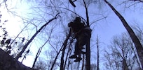 Sgt. 1st Class John Sharbel, with the Tennessee Army National Guard, and an injured hiker are hoisted into a hovering UH-60 Black Hawk helicopter in the Great Smoky Mountains National Park, March 22, 2025.