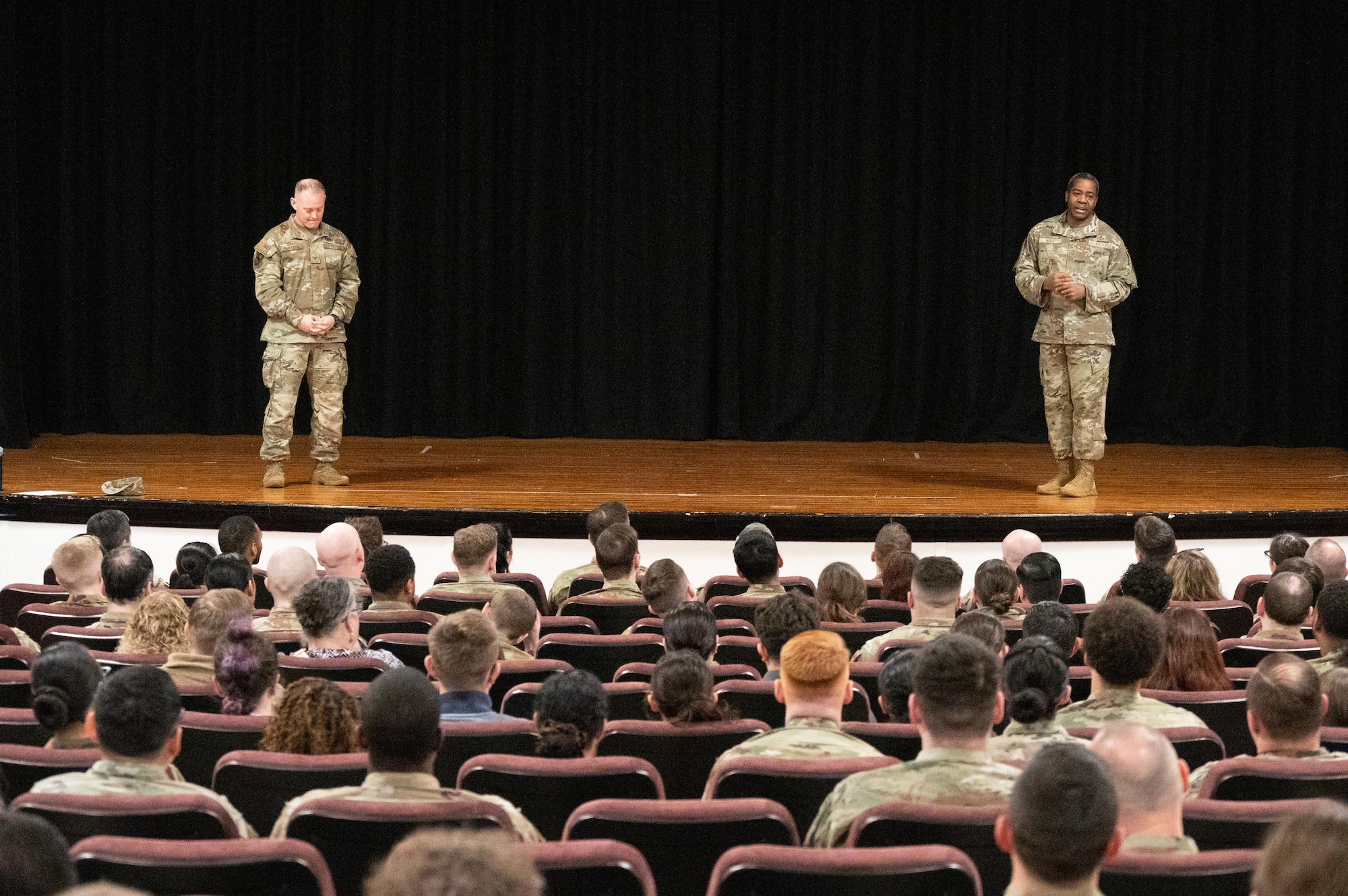 U.S. Air Force Col. D. Landon Phillips, 501st Combat Support Wing (CSW) commander and Chief Master Sgt. Terrance Boyd, 501st CSW command chief, speak during an all call