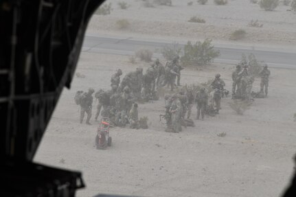 In the chilly, dusty morning at Fort Irwin, California, aka the “Sandbox,” March 11, 2025, four Oregon Army National Guard CH-47F “Chinook" helicopters load Soldiers from the 82nd Airborne Division’s Combat Aviation Brigade.
