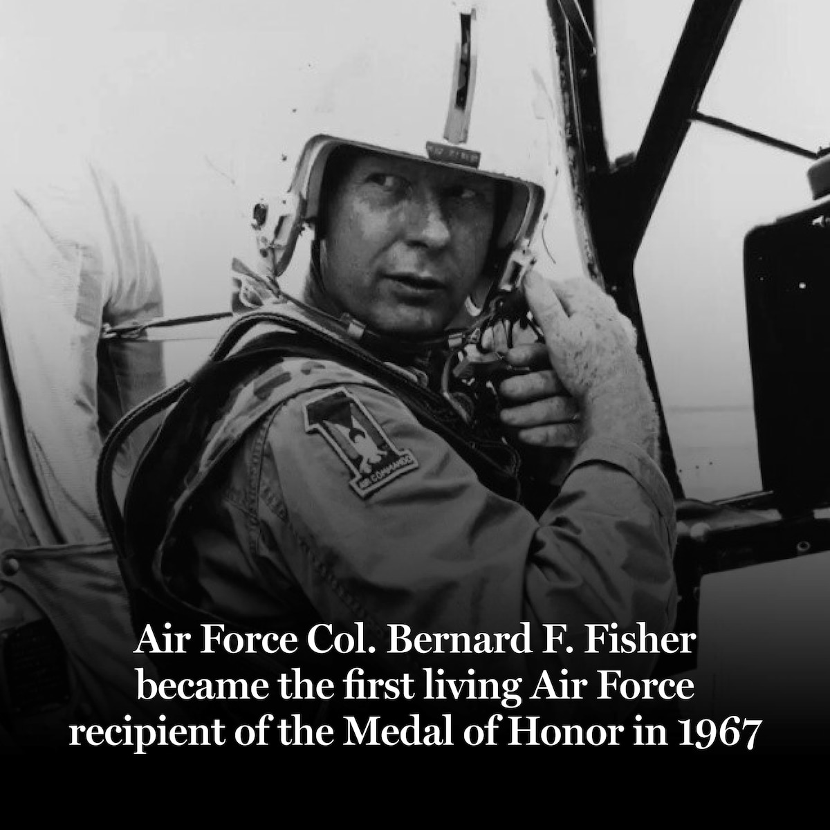 Airman adjusting helmet