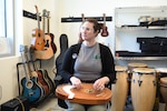 Clare Hogan, a music therapist at the Fort Carson Intrepid Spirit Center demonstrates how a reverie harp is used to assist with brain injury treatment. The Intrepid Spirit Center, or ISC, hosted an open house Friday, March 21, 2025, to increase awareness for the center’s services, and to support Brain Injury Awareness Month.