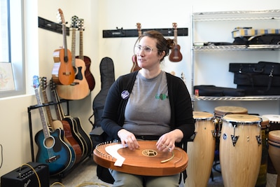 Clare Hogan, a music therapist at the Fort Carson Intrepid Spirit Center demonstrates how a reverie harp is used to assist with brain injury treatment. The Intrepid Spirit Center, or ISC, hosted an open house Friday, March 21, 2025, to increase awareness for the center’s services, and to support Brain Injury Awareness Month.