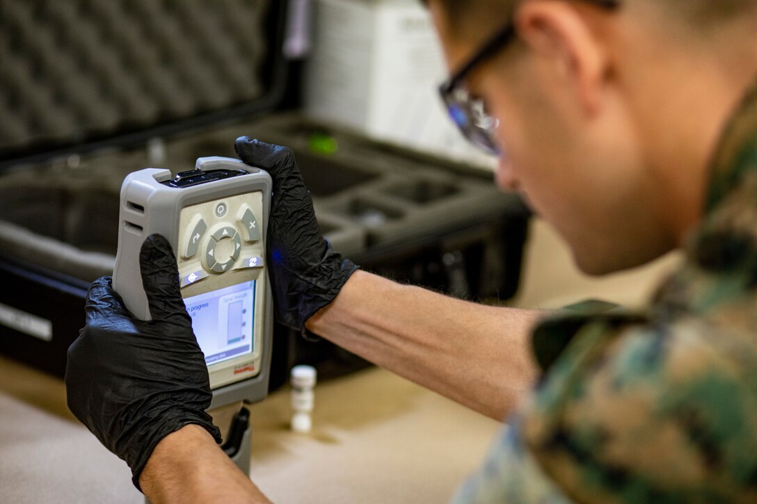 U.S. Marine Corps Staff Sgt. Stephen Sulpy, a criminal investigation division (CID) agent with 1st Law Enforcement Battalion, I Marine Expeditionary Force Information Group, tests the chemical composition of a sample during training at Marine Corps Base Camp Pendleton, California, March 10, 2020. CID agents provide essential support to commanders at both home station and in deployed environments, and are at the forefront of protecting Marines and families, facilities, and mission-essential equipment. (U.S. Marine Corps photo by Cpl. Seth Rosenberg)