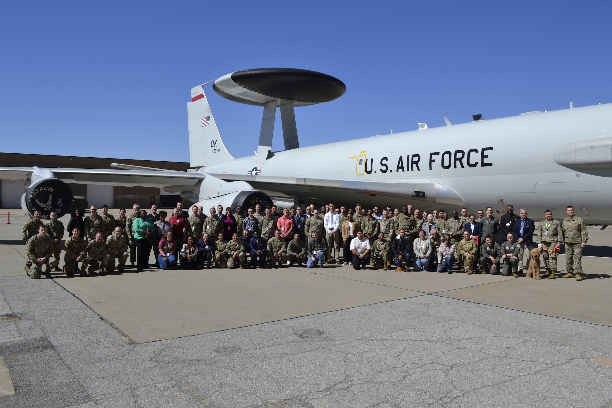 Group of people standing in front of E-3 Sentry aircraft