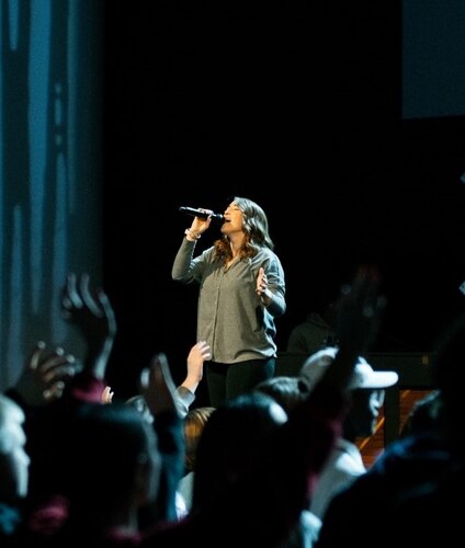 Breana Quimby, 42nd Operational Medical Readiness Squadron environmental health technician, sings at Highpoint Church in Montgomery, Alabama, in Feb. 2024.