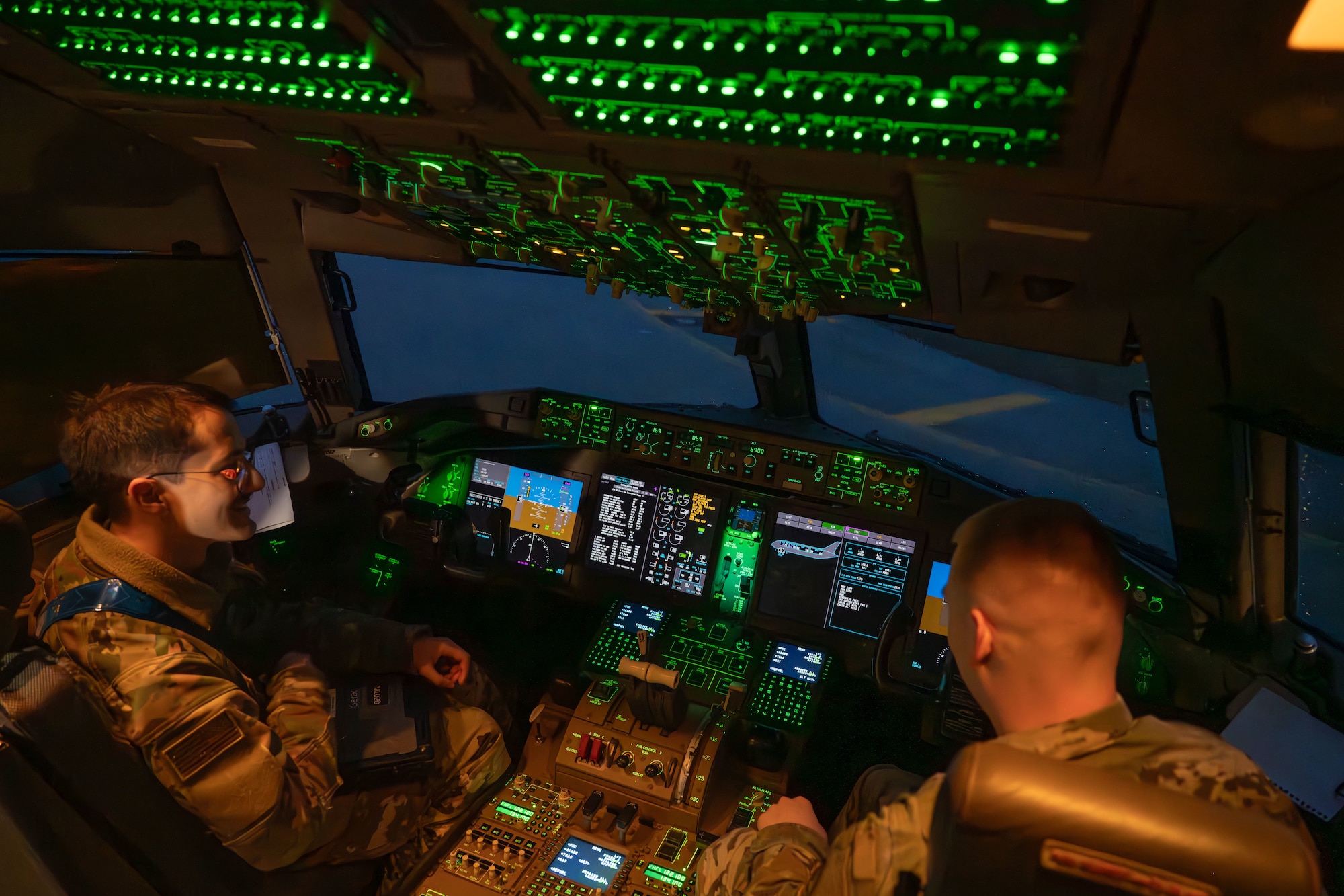 From left, Senior Airman Christian Capps, 22nd Aircraft Maintenance Squadron flying crew chief, and Staff Sgt. William Lisk, 22nd AMXS electrical and environmental systems specialist, perform preflight maintenance in a KC-46A Pegasus during exercise Fighting Wyvern 25-01 at Aviano Air Base, Italy, March 11, 2025. 22nd AMXS Airmen participated in the exercise by supporting and maintaining two KC-46A Pegasuses. (U.S. Air Force photo by Airman 1st Class Paula Arce)