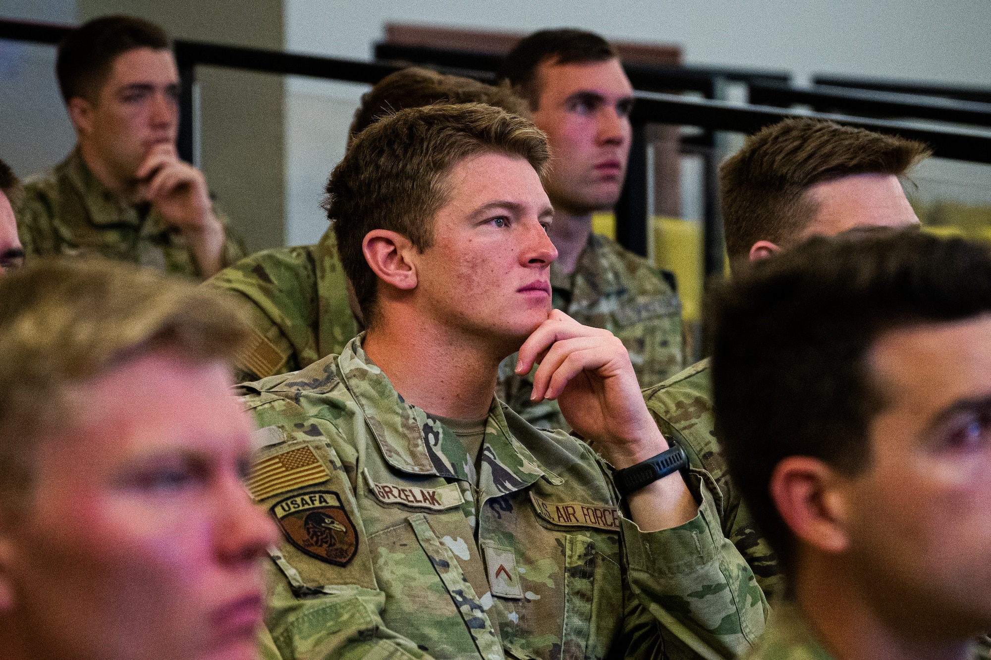Cadets from the United States Air Force Academy rugby team learn about flight equipment during a tour at Aviano Air Base, Italy, March 21, 2025.