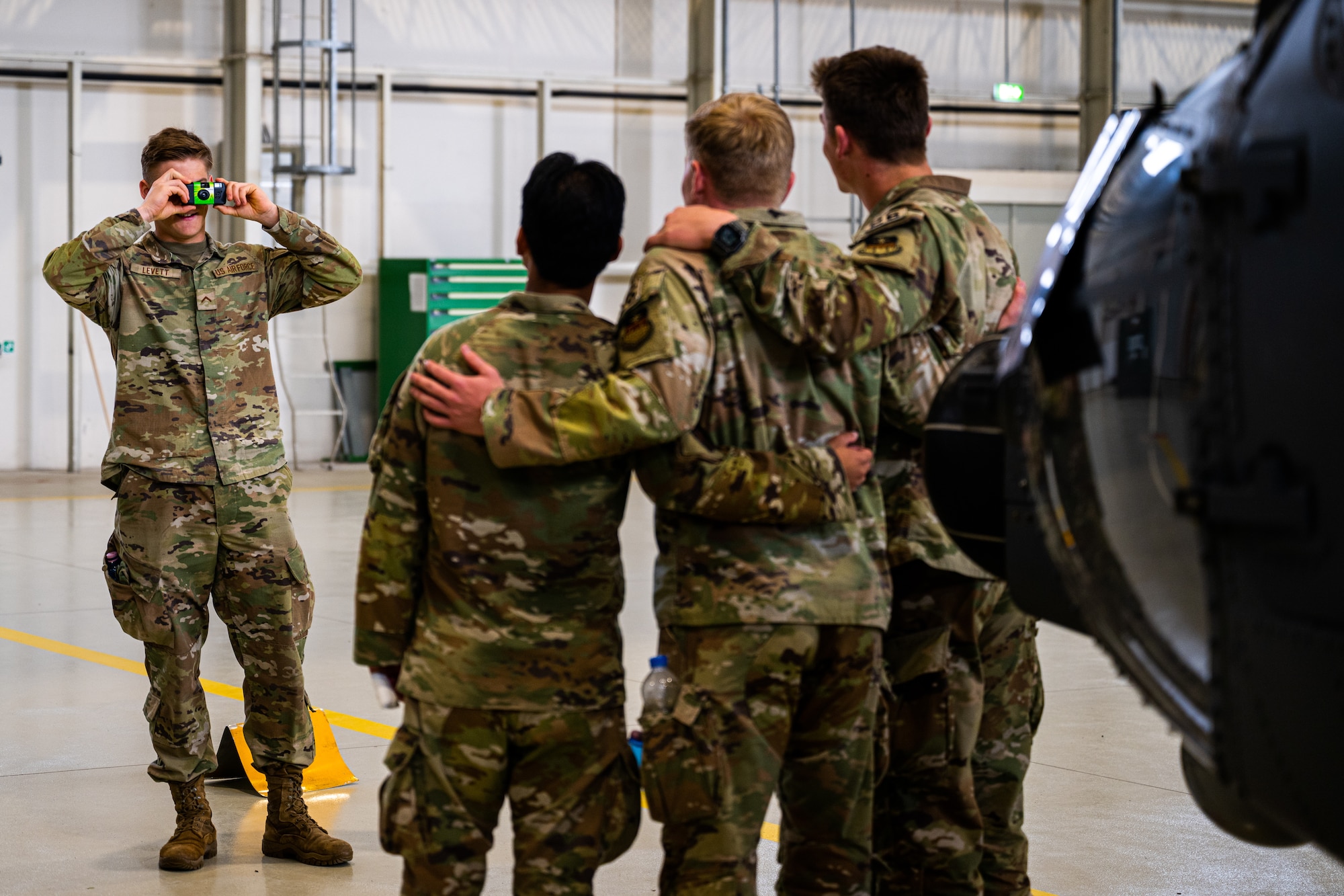Cadets from the United States Air Force Academy rugby team learn about flight equipment during a tour at Aviano Air Base, Italy, March 21, 2025.