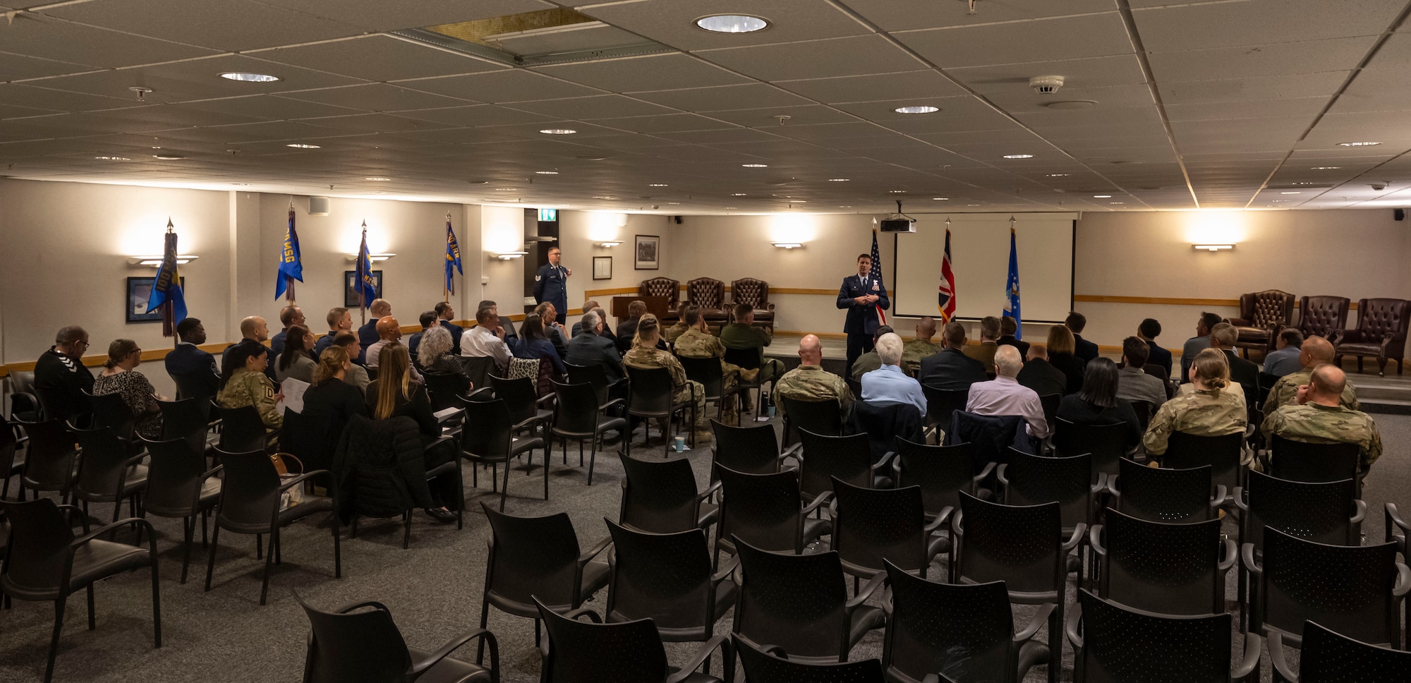 U.S. Air Force Col. Ryan Garlow, 100th Air Refueling Wing commander, speaks at the opening of the honorary commanders’ induction ceremony at RAF Mildenhall, England, March 21, 2025.