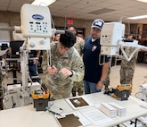 Lawrence Coleman, right, a logistics assistance representative with U.S. Army Medical Logistics Command, oversees medical maintenance training for the 61st Multifunctional Medical Battalion and 582nd Medical Logistics Company at Fort Cavazos, Texas, Feb. 5.