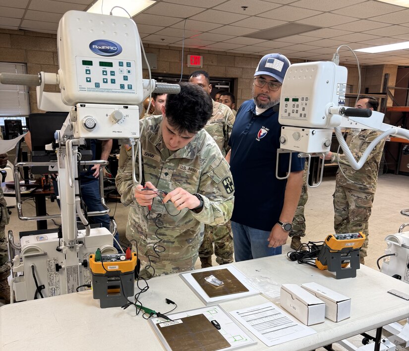 Lawrence Coleman, right, a logistics assistance representative with U.S. Army Medical Logistics Command, oversees medical maintenance training for the 61st Multifunctional Medical Battalion and 582nd Medical Logistics Company at Fort Cavazos, Texas, Feb. 5.