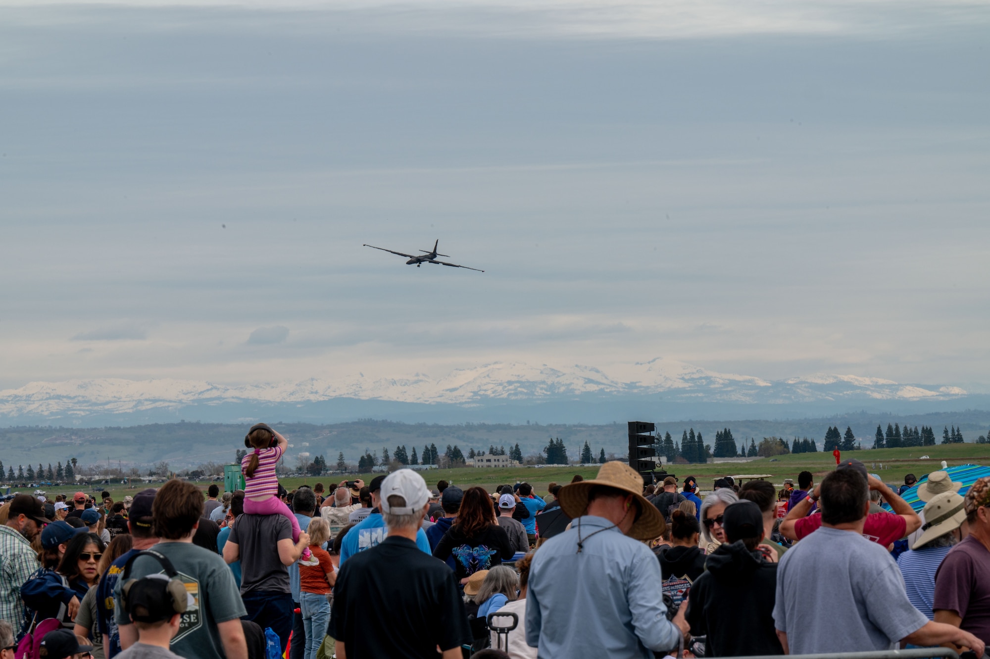 A crowd at the California Capital Airshow watches as a U-2 “Dragon Lady” from Beale Air Force Base, California, approaches to perform a touch-and-go landing, Mather, California, March 22, 2025.