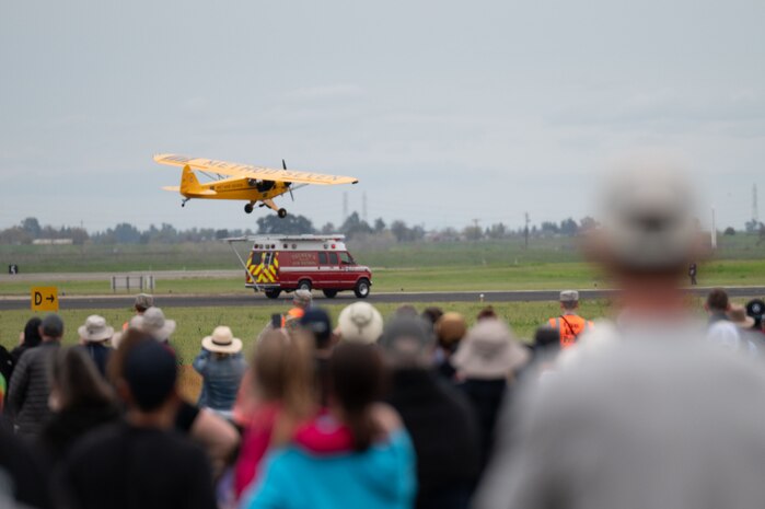 A Piper J-3 Cub piloted by Eric Tucker lands on a moving ambulance at the California Capital Airshow, Mather California, March 22, 2025.