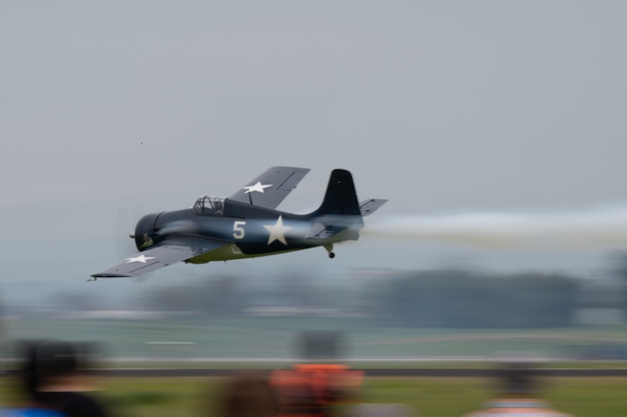 A Grumman F-4F Wildcat flies past with aerobatic smoke trailing behind at the California Capital Airshow, Mather California, March 22, 2025.