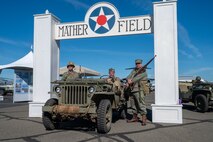 World War II reenactors around a Ford Manufactured GPW “Jeep” at the California Capital Airshow beneath the Mather Field sign at Mather, California, March 23, 2025.