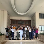Navy Capt. Sarah Nolin, Navy Lt. Cmdr. Lisnnette Rhea, Caleb Goddard, acting Deputy Chief of Mission at the US Embassy of Mauritius, Navy Reserve Chief Petty Officer Amber Baker-Ruiz, and Master Sgt. Ellie Rivas pose for a photo during Cutlass Express 2025. Navy Reserve Chief Petty Officer Amber Baker-Ruiz, USMEPCOM program analyst, facilitated a peace and security symposium during Cutlass Express 2025 in Port Louis, Mauritius.