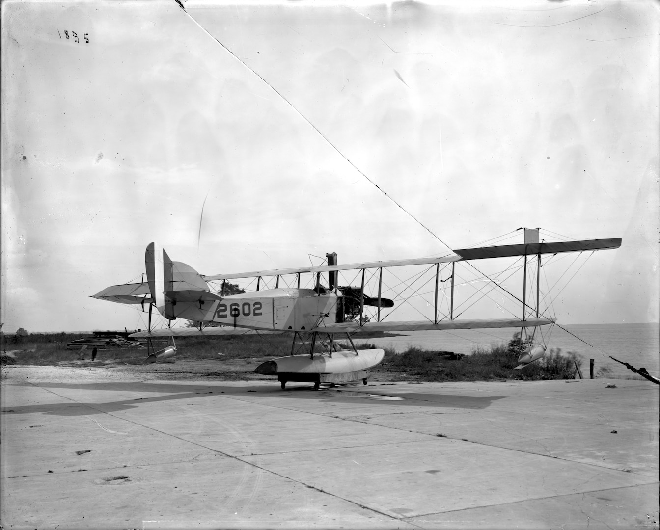 The first radio-controlled plane was an open cockpit, amphibious biplane. Its first totally unmanned flight took place September 15, 1924 (NSWCDD photo by Morgan Tabor).