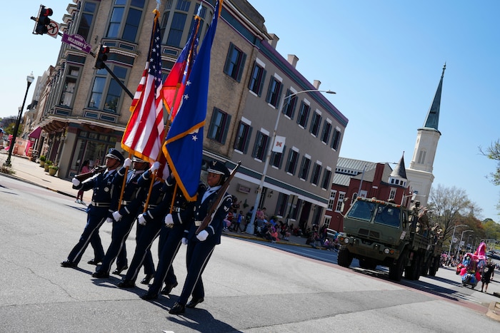 Robins Air Force Base Honor Guard members march down Mulberry Street in Macon, Georgia at the 43rd annual International Cherry Blossom Festival.