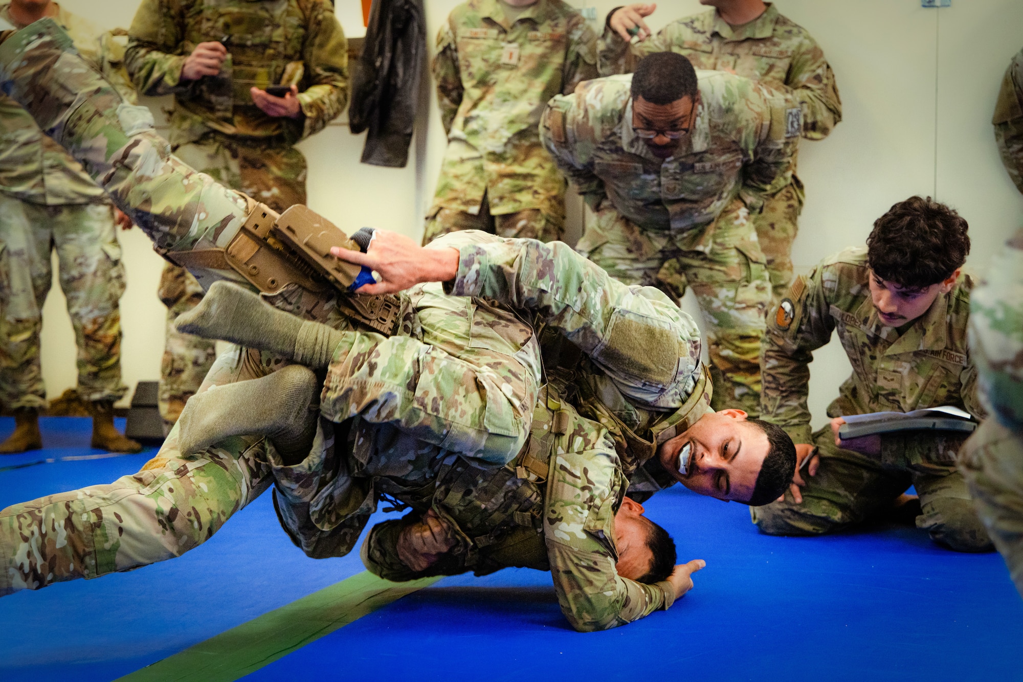 Two Security Forces Airmen fight for position and positive control of a weapon during the combatives portion of the 412th Security Forces Squadron’s Advanced Combat Training Exercise at Edwards Air Force Base, California, March 12. (Air Force photo by Blaine Torres)