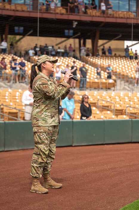 U.S. Air Force Master Sgt. Michelle Gagnon, 607th Air Control Squadron plans and programs flight chief, sings the National Anthem during the 2025 Military Appreciation game, Mar. 23, 2025 at the Camelback Ranch baseball complex, Glendale, Arizona.